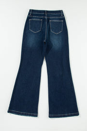 Dark wash denim widecut jeans with frayed hem and pocket details.