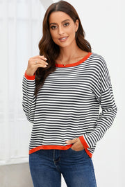 Nautical knit crewneck sweater with black and white stripes and contrast red trim.