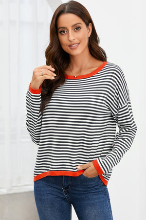 Nautical knit crewneck sweater with black and white stripes and contrast red trim.