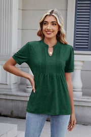 Dark green pleated yoke henley tee with keyhole neckline and short sleeves.