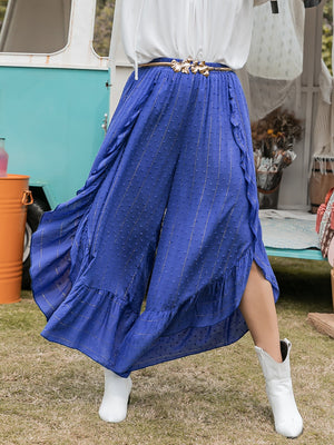 Azure ruffle overlay palazzo trousers in royal blue with gold pinstripes and polka dots.