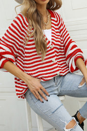 Bold stripe acrylic cardigan in deep red with balloon sleeves and button front.
