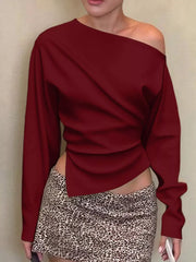 Burgundy draped asymmetrical off-shoulder t-shirt with long sleeves and a unique hemline.