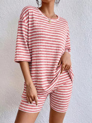 Pink striped two-piece set with elbow sleeves and shorts.
