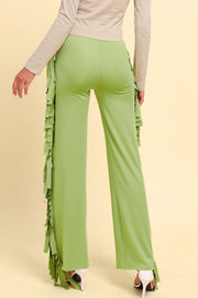 Yellow-green palazzo trousers with cascading fringe detail on the sides.
