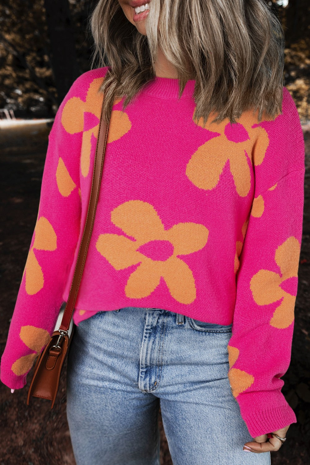 Cerise oversized knit sweater with orange floral pattern, crew neck, long sleeves.