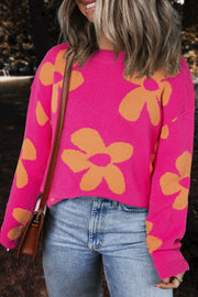 Cerise oversized knit sweater with orange floral pattern, crew neck, long sleeves.
