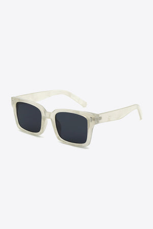 Transparent marble effect rectangular sunglasses with dark lenses.