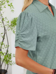 Sage eyelet ruched short sleeve blouse with a collared neckline.