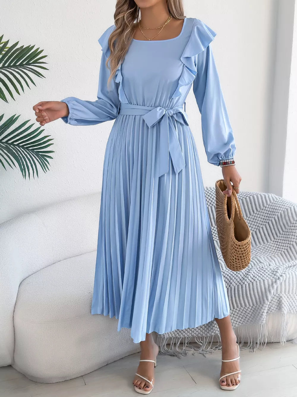 Blue ruffled A-line midi dress with long sleeves, square neckline, and pleated skirt.