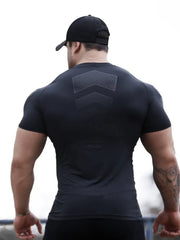 Black performance mesh sculpt tee with chevron detail on back.