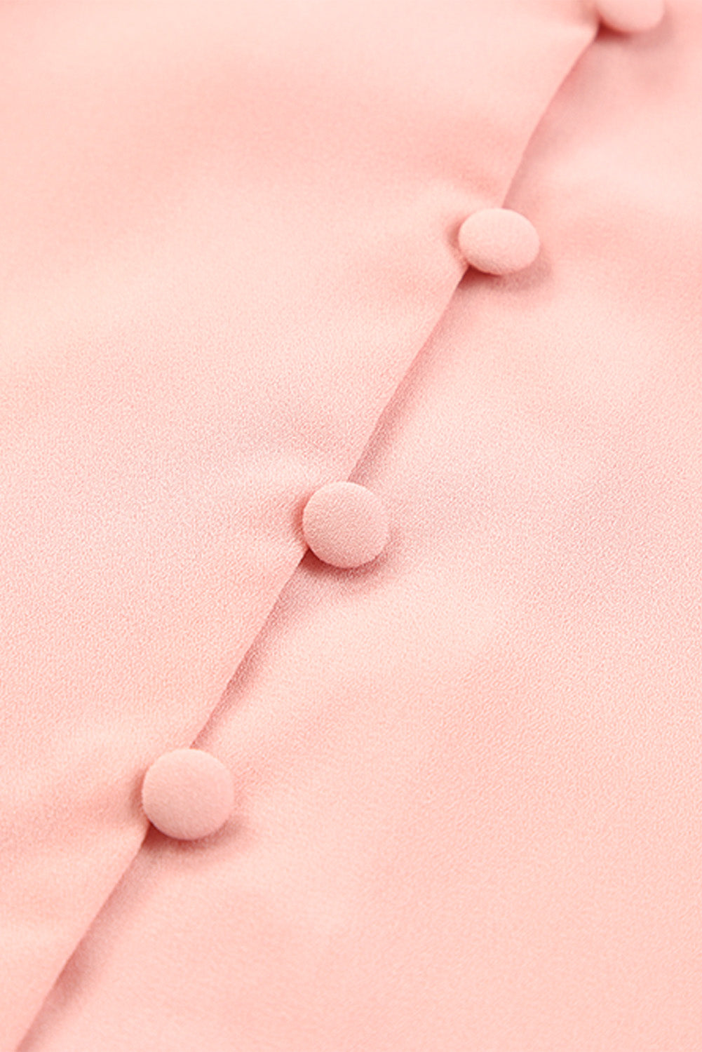 Peach button-down blouse with fabric-covered buttons and tie-front detail