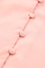 Peach button-down blouse with fabric-covered buttons and tie-front detail