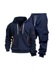 Navy blue half-zip hoodie and cargo pants set with orange zipper details and drawstring waist.