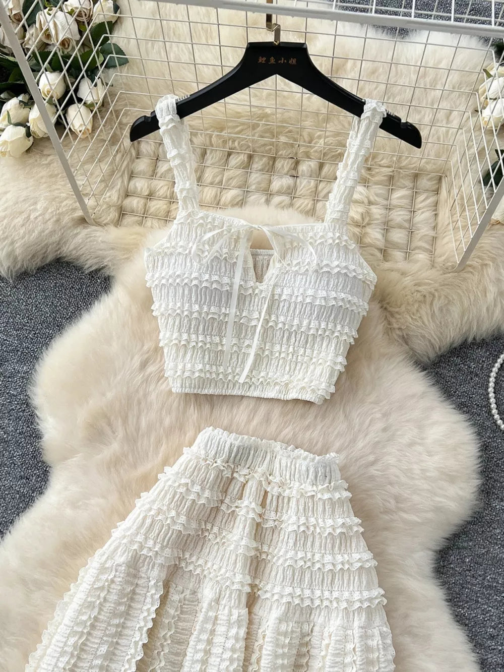 White ruched crop top with tie detail and tiered maxi skirt set.