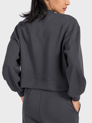 Dark blue cropped crewneck sweatshirt with gathered sleeves and crew neckline.