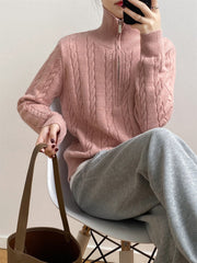 Dusty Pink cable knit quarter-zip pullover sweater with a mock neck and silver zipper.