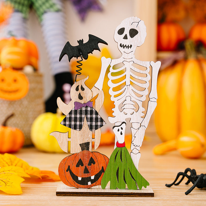 Spooky wooden Halloween scene set with skeleton, ghost, pumpkin, bat, and broom decorations.