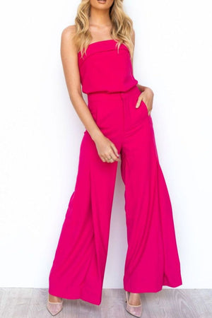 Hot pink structured bandeau top and wide-leg pants suit with pockets.