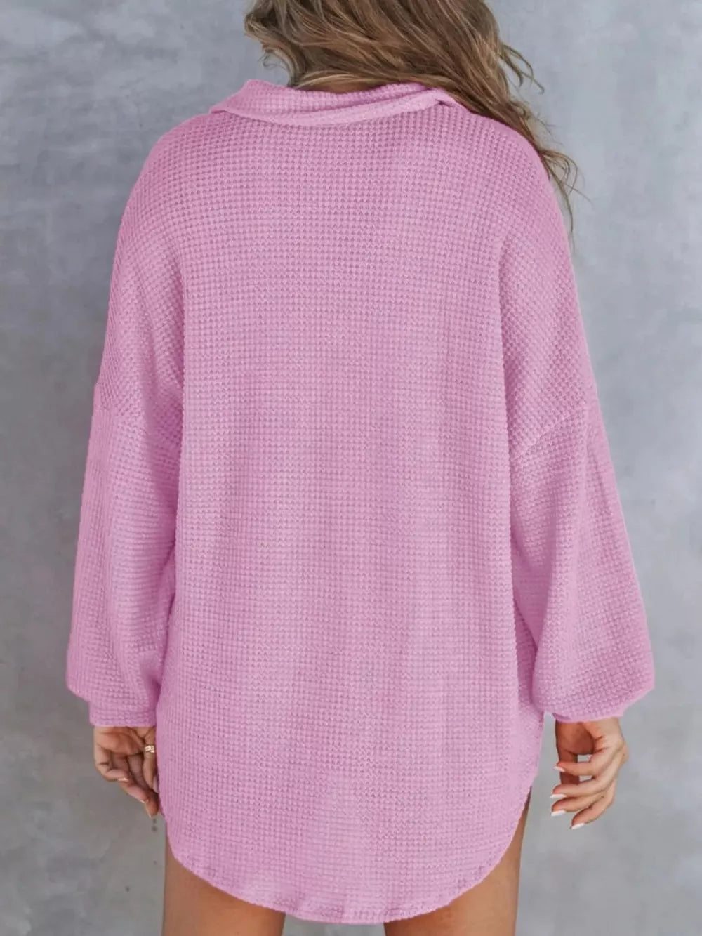 Waffle-knit henley tee in light purple with long sleeves and a collared neckline.