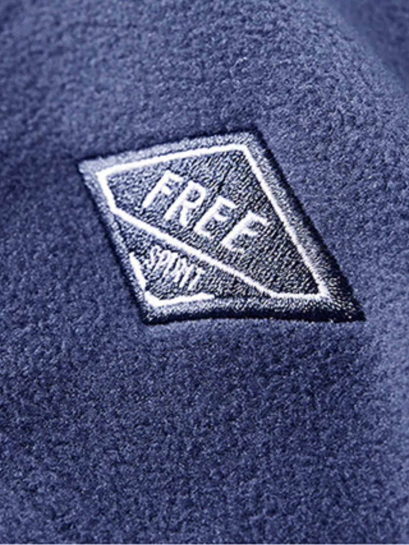 Men's blue fleece quarter zip sweatshirt with embroidered patch detail.