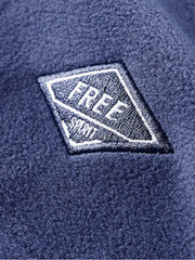 Men's blue fleece quarter zip sweatshirt with embroidered patch detail.