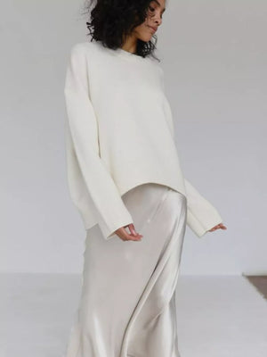 White soft knit sweater with ribbed detailing and crew neck.