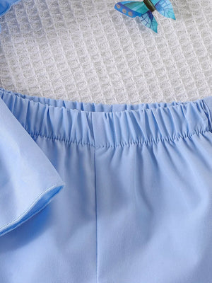 Children's Bow Puff Sleeve Top And Shorts Set in Blue, model styling view