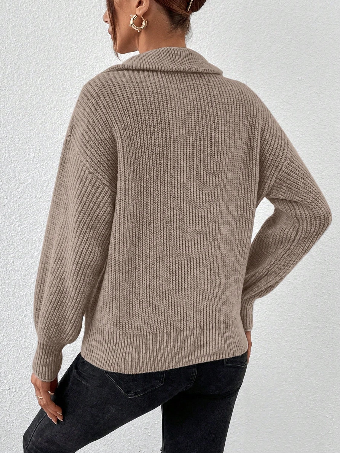 Taupe ribbed collar zip-up knit sweater with balloon sleeves.