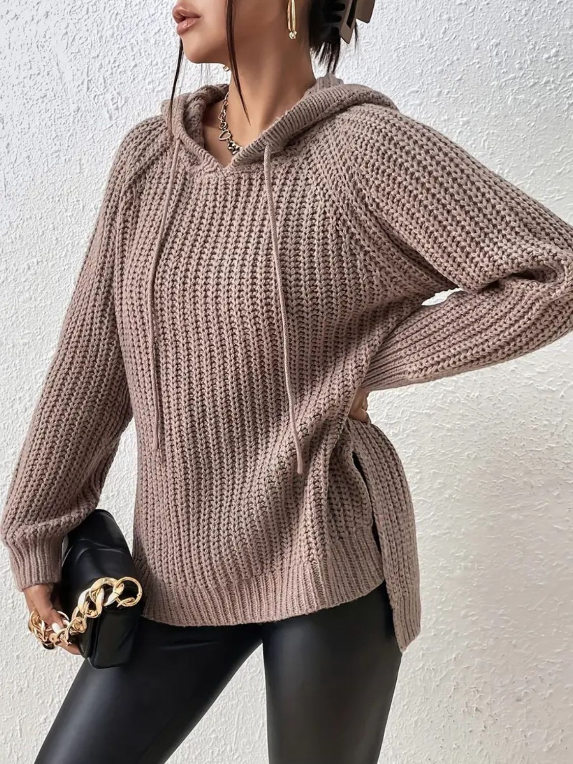 Textured knit mocha hoodie with drawstring and side slits, relaxed fit.