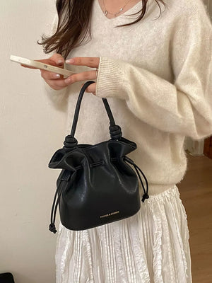 Drawstring Bucket Crossbody Bag in Black, side view
