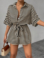 Black and white striped shirt romper with self-tie belt and button front.