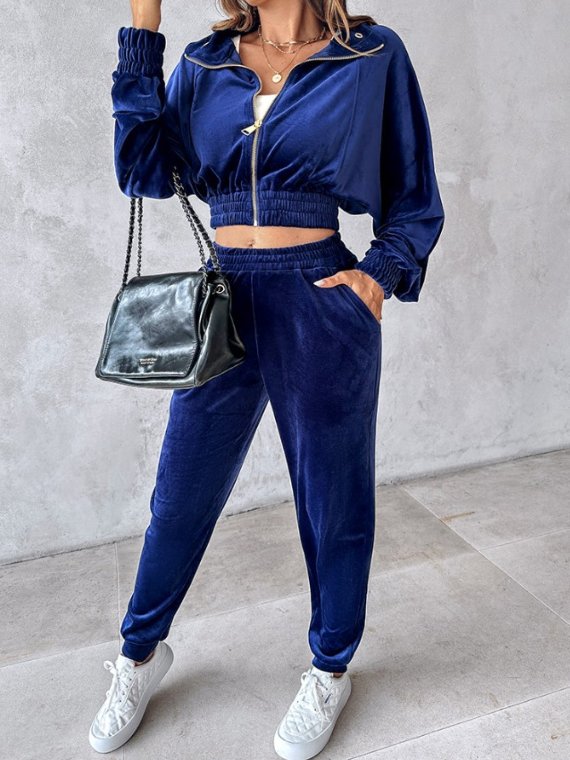 Velvet crop tracksuit in navy with zipper detail and elasticated cuffs and hem.