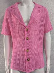 Pink open-knit herringbone resort shirt with short sleeves and button front.