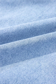 Light blue denim sundress with ruffled hem detail