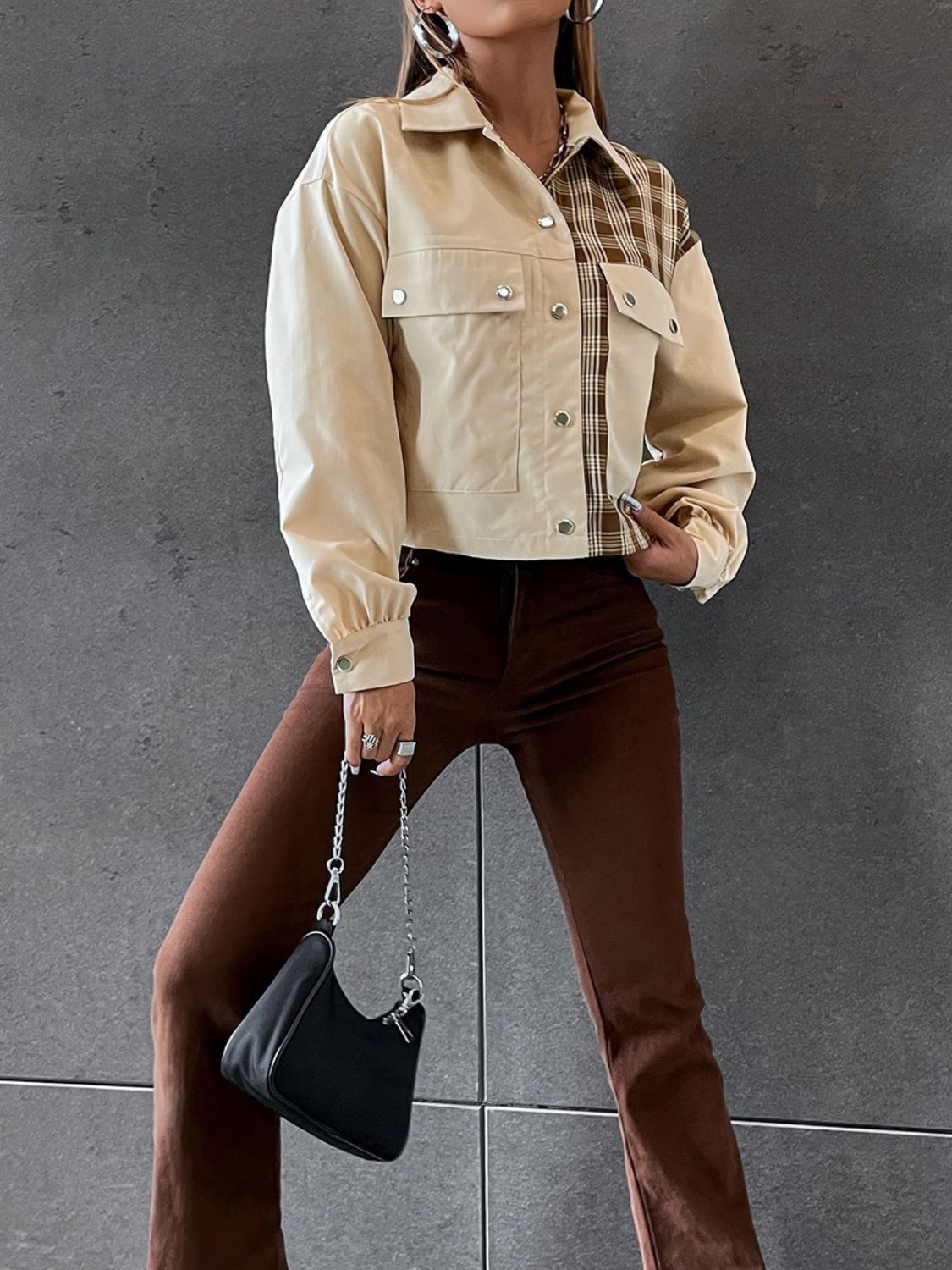Beige panelled plaid and faux leather jacket with button details and pockets.