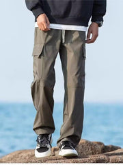Relaxed fit army green cargo pants with flap pockets and drawstring waist.