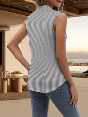 Sleeveless striped button-up shirt with a stand collar, paired with jeans.