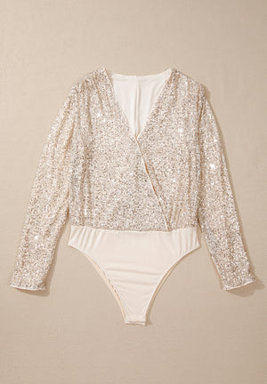 Sequin wrap bodysuit in ivory with long sleeves and deep V-neck.