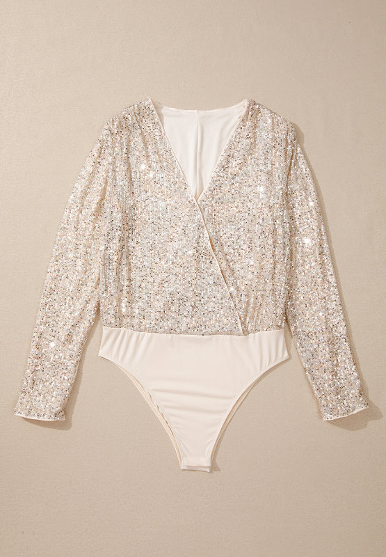 Sequin wrap bodysuit in ivory with long sleeves and deep V-neck.