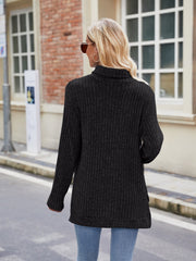 Black ribbed turtleneck sweater with side slits, long sleeves, and a relaxed fit.