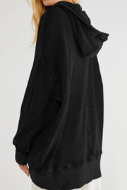 Black waffle knit hooded zip-through jacket with a relaxed fit and ribbed cuffs.