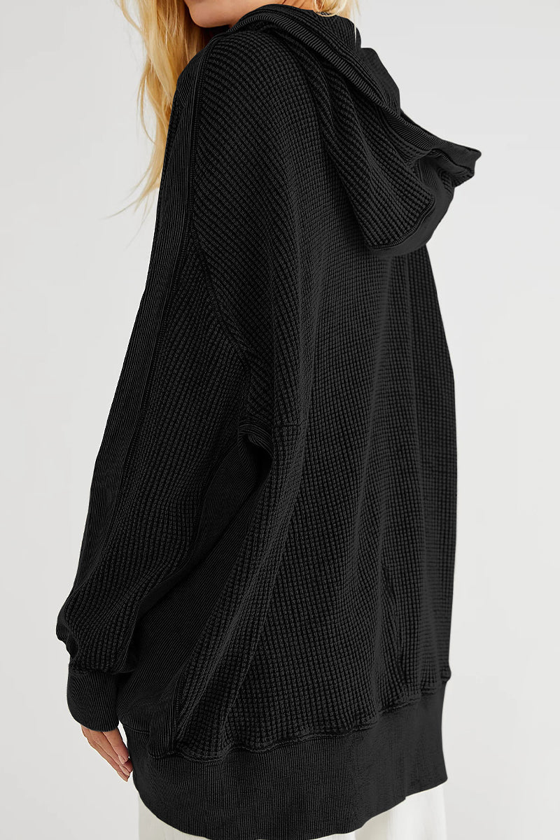 Black waffle knit hooded zip-through jacket with a relaxed fit and ribbed cuffs.