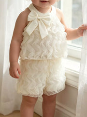 Cream ruffled baby top and shorts set with bow detail