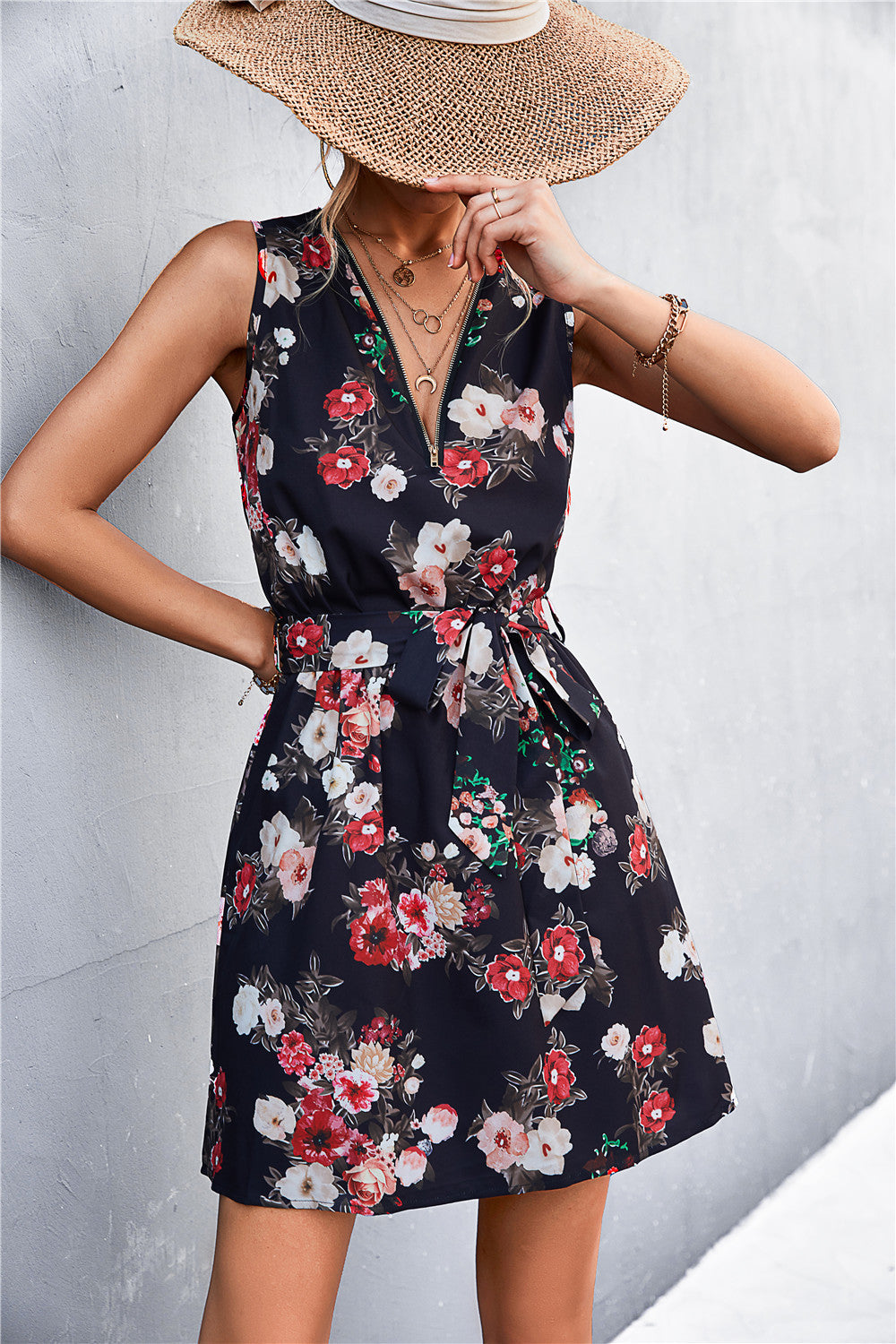 Black floral mini dress with zip-front and tie waist