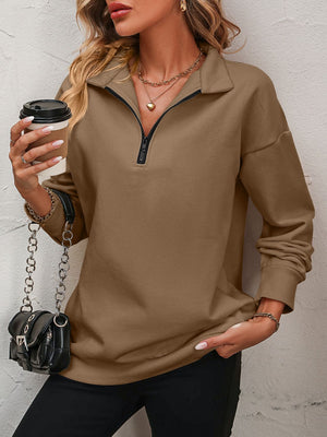 Camel quarter-zip relaxed fit sweatshirt with a black zipper detail.