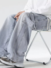 Light blue oversized cargo jeans with drawstring waist and utility pockets.
