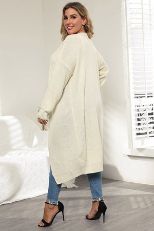 Oversized ivory knit maxi cardigan with a relaxed fit and long sleeves.