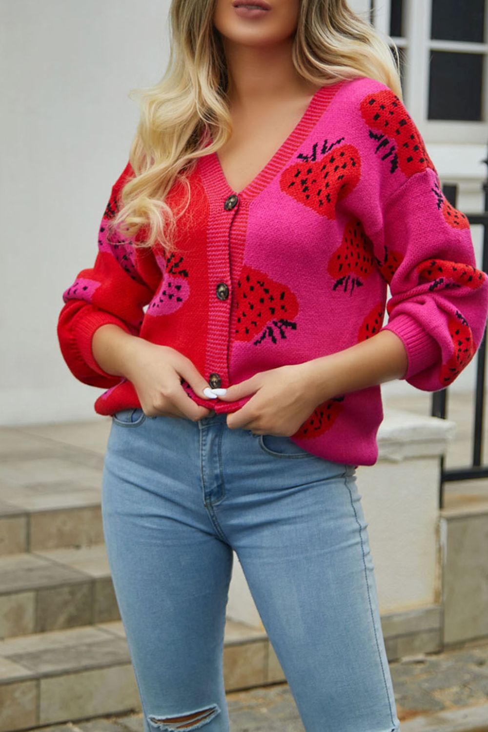 Strawberry patchwork V-neck cardigan in hot pink and red acrylic with button front.