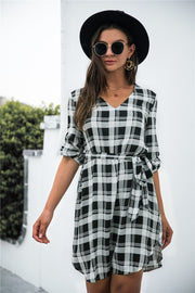 Black plaid shirtdress with V-neck, 3/4 sleeves, and belted A-line cut